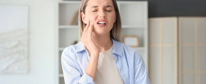 Emergency dentist in Alexandria VA treating patient with sudden tooth pain