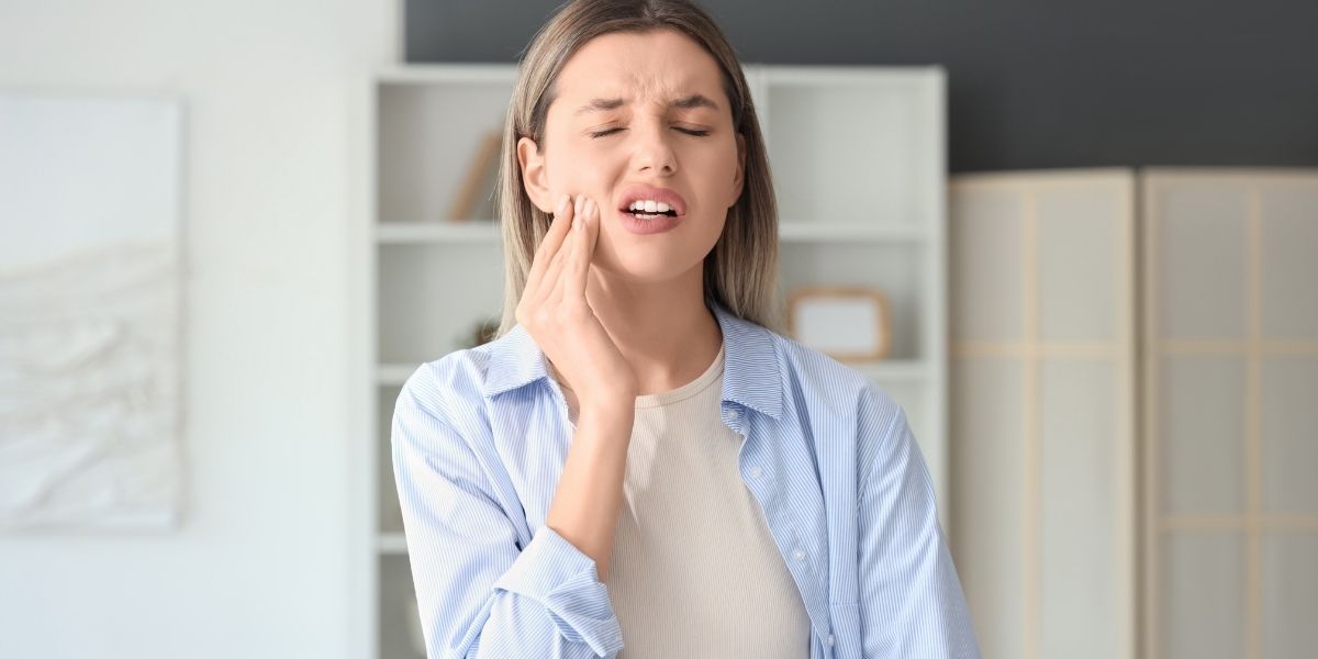 Emergency dentist in Alexandria VA treating patient with sudden tooth pain